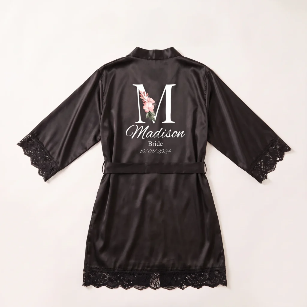 Black satin and lace robe printed with an initial, a name and Bride on the back