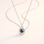 Silver necklace with a round photo projection pendant