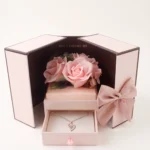 Pink gift box with preserved roses and a rose gold heart projection necklace